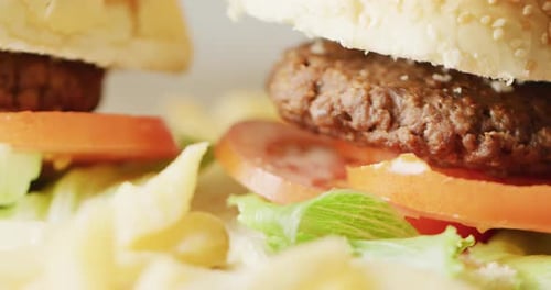 Video close up of two hamburgers with salad in burger buns