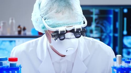 Scientist Working with Test Tubes in Laboratory