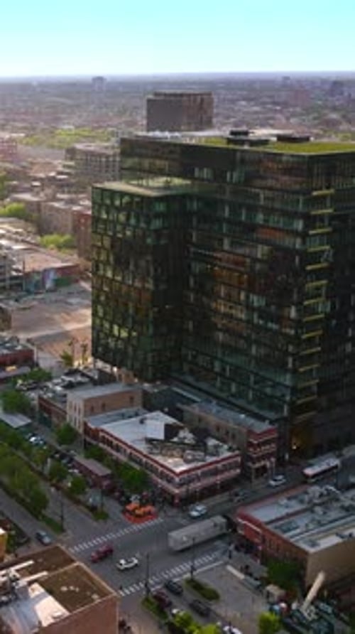 Flyover Chicago city panorama. Busy roads among the multi-storied buildings of metropolis.