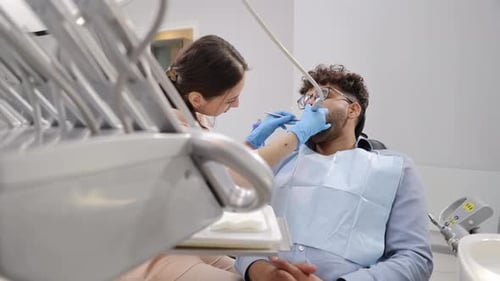 A Patient Undergoing Dental Care in a Modern Clinic Setting Highlighting the Utmost Professionalism