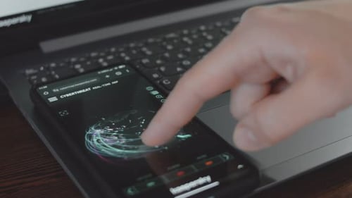 Smartphone Displaying Cybersecurity Application Being Used by Finger