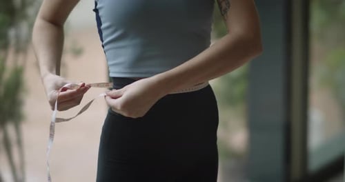Close Up Shot of Fit Girl Measuring Her Perfect Waist Female Athlete Losing Extra Weight After