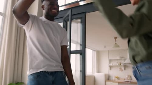 Excited Couple Celebrates Good News at Home