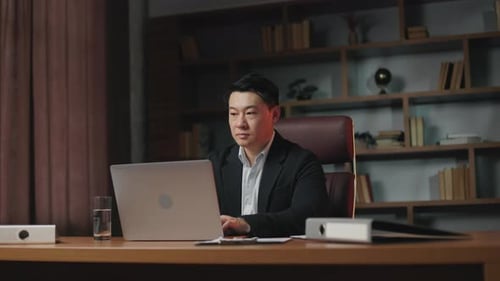 Entrepreneur Turning Off Laptop and Thinking of Work Results