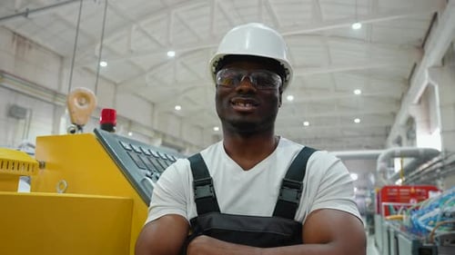 Portrait of African American Worker Near CNC Machine in Factory Industries