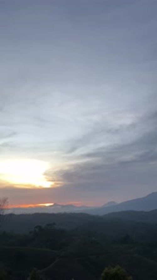 Beautiful Sunrise Over a Lush Mountain Landscape