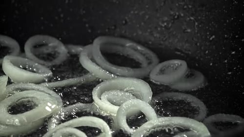 Onion Rings are Fried in a Pan Filmed on a Highspeed Camera at 1000 Fps