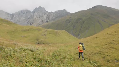 Backpacker Hiking In Mountain In Autumn