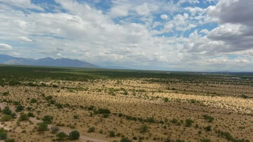 Wide aerial shot of the desolate Sonoran desert in Arizona, slow moving drone shot