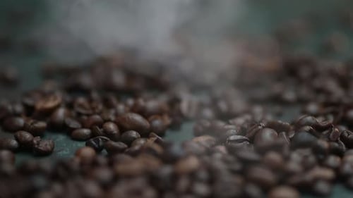 Close-up of a smoke falling on the coffee bean