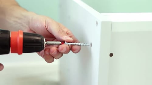 Professional furniture assembling. Installation of new furniture. Furniture assembly. 4k footage.