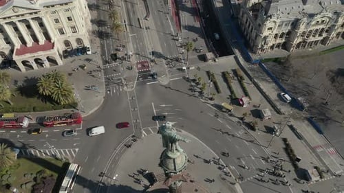 Aerial Descending Footage of Columbus Statue on Column High Above Streets