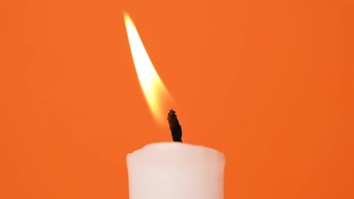 Close up Of Candle Flame Burning Warmly