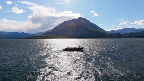 Ship navigating on Lake Como, Italy on a sunny day