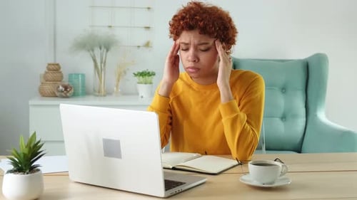 African Woman Touching Temples Experiencing Stress Girl at Home Office Tired of Working Feeling