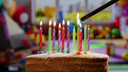 Woman Kid Child Blowing Candles on Birthday Cake Macro Close Up of Some Unlit Candles and Just One