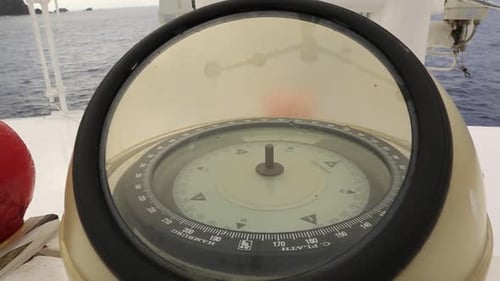 Compass points the direction of the oceanic journey