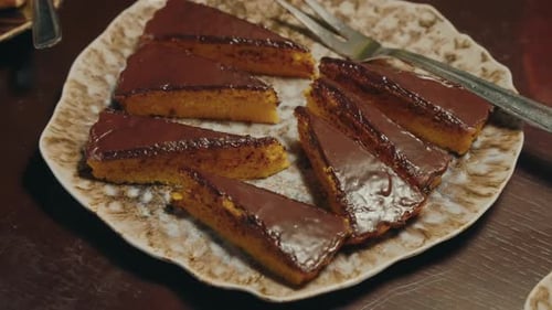 Delicious chocolate glazed cake slices on a plate