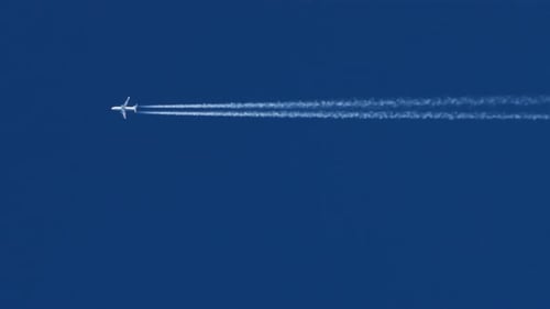 The Journey Begins Plane Flies High in the Blue Sky Leaving a White Trail Jet Airplane Flying
