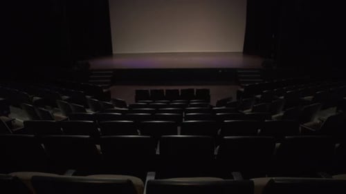 Seats and Stage in Dark Empty Auditorium Absence