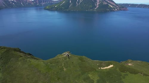 AERIAL Helicopter Standing on the Edge of Krenitsyn Volcano