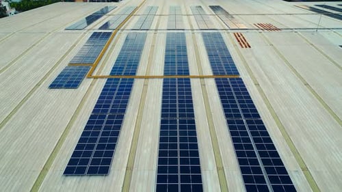 Solar Panels Are Installed on a Building's Roof Providing Clean Energy