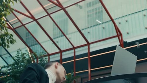 Man in Blindfold Starting Dancing in Middle of Office Work on Laptop