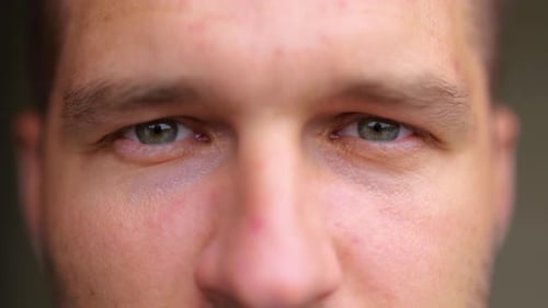 Extreme Close Up of Handsome Young Man Face Looking at Camera and Smiling Positive Emotions