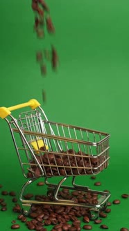 Roasted Beans Cascade Into Trolley Display Of Brown Roasted Beans Filling Shopping Cart