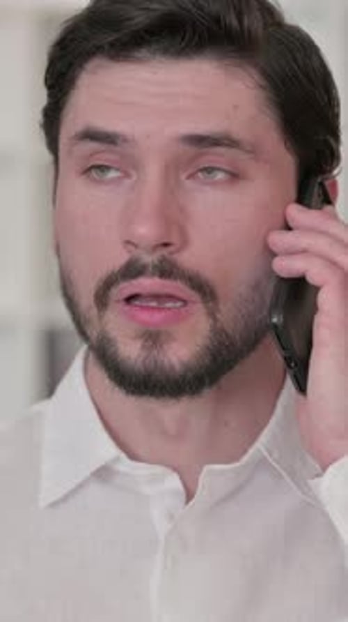 Man Talking on Cellphone Close-Up Portrait