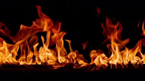 Burning Flames Against Black Background