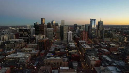 Aerial over the Denver skyline at dusk, Colorado, USA. Drone dolly forward shot