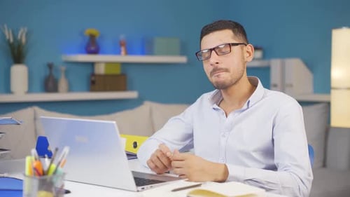 Home office worker man thinking about private life problems.