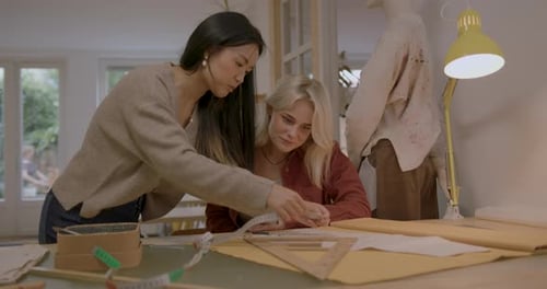 Fashion Design Students in Atelier Making Clothes