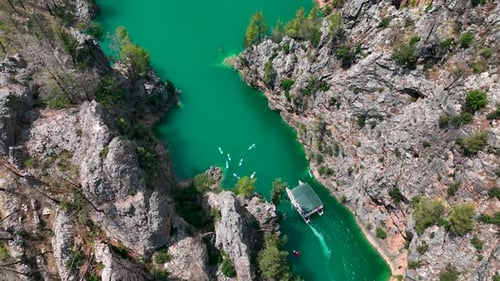 Aerial View Paddleboarding Adventure in the Large Green Canyon People Swimming and Relaxing in the