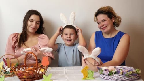 Family Making Cheerful Easter Decorations Together Indoors