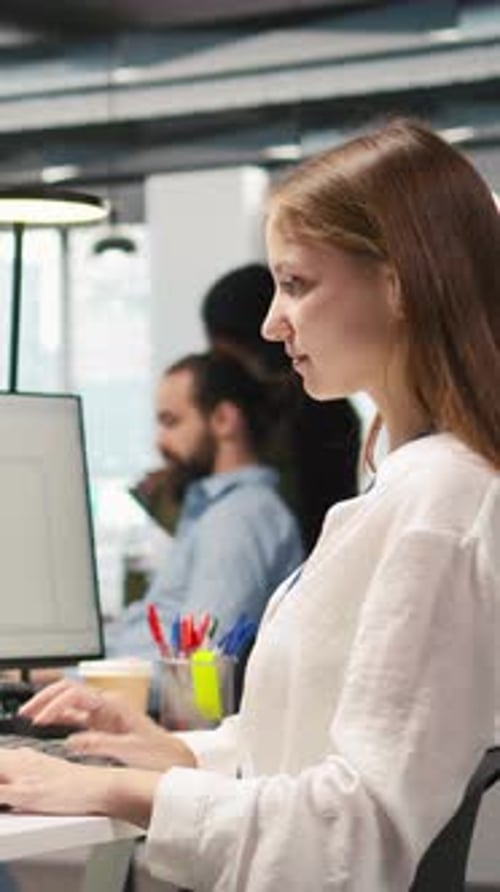 Vertical Video Female Technician Using AI LLM Chatbot to Automate Tasks in Office