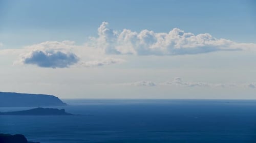 Serene seascape with fluffy clouds in the sky, Taiwan.