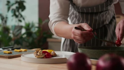 Chef Plates Gourmet Vegetarian Dish in Kitchen