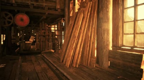 Sunlight Streaming Through a Workshop Window Illuminating Stacks of Lumber