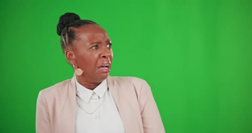 Fright, shocked and disgust with a black woman on a green screen background in studio looking