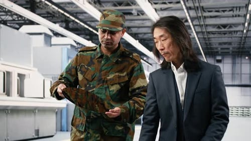 Soldier Talks with Microchip Plant Manager National Security Concept