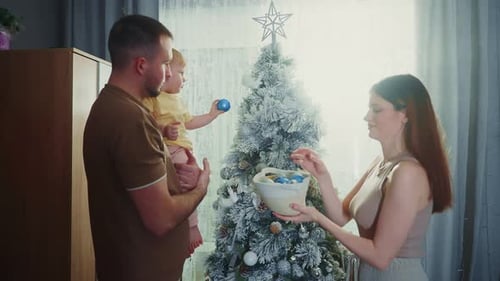Family Decorating Christmas Tree with Child, Holiday Season