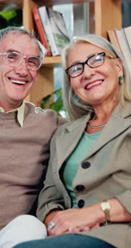 Smiling Senior Couple Laughing Together Indoors