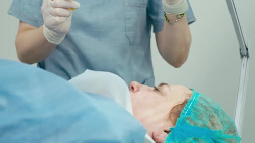 Woman Receives Facial Treatment in Doctor's Office