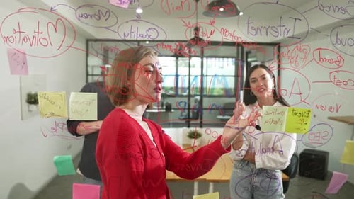 Team Brainstorming Ideas Together in Modern Office