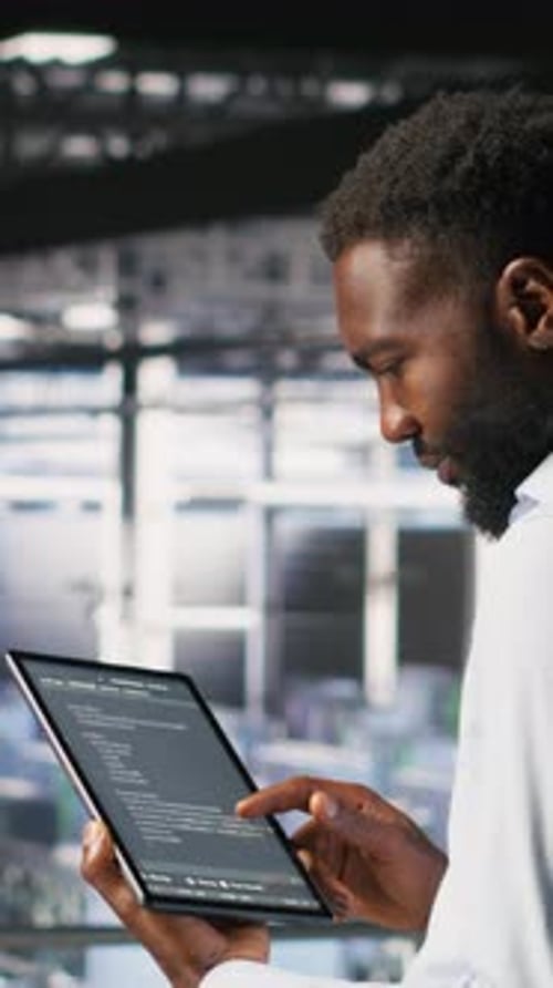 Vertical Video Data Center Programmers on Industrial Platform Checking Lines of Code
