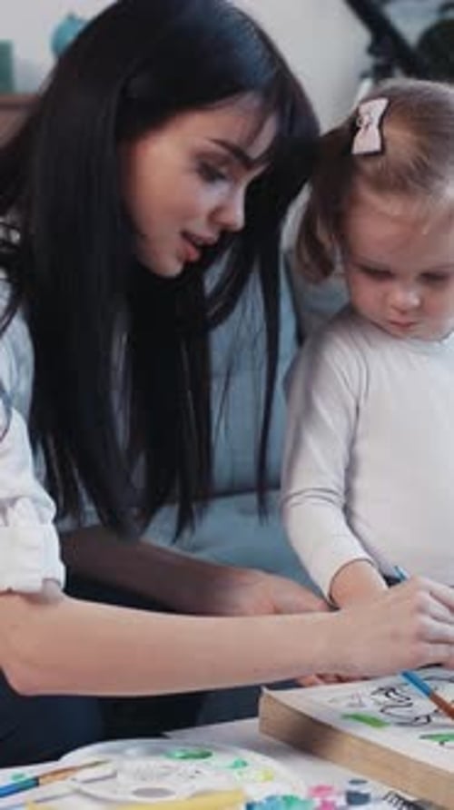 Creative Art Time A Mother and Her Daughter Engaging in Various Fun Activities Together