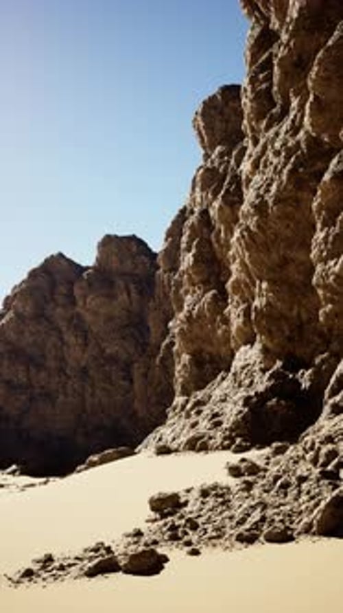 Sandy Beach and Rocky Cliff Landscape