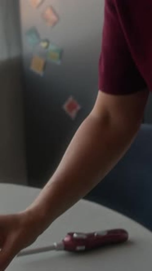 Placing Birthday Candles on Cake in Indoor Setting